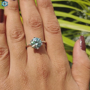 Round twisted engagement ring featuring a prong setting.
