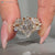 Marquise ring with open gap and tapered shank.