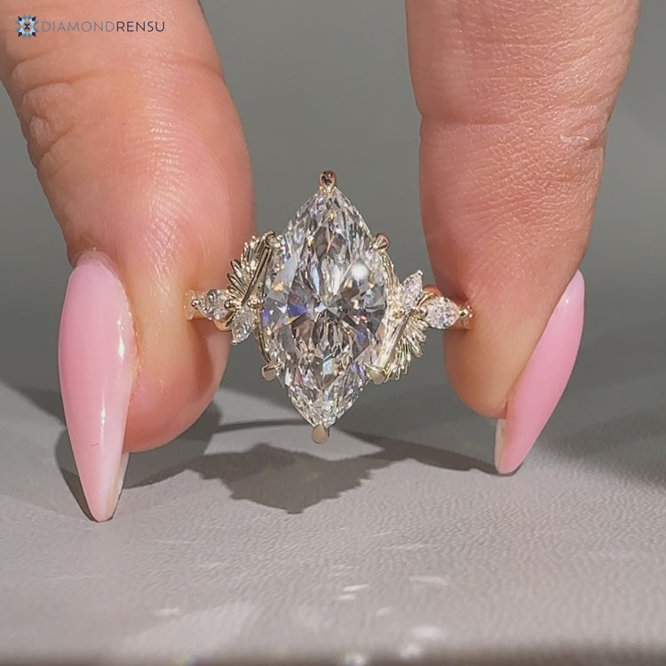 Marquise side stones complement this marquise cut diamond ring.