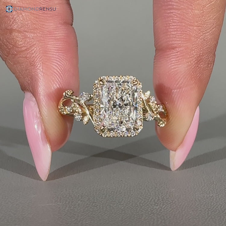 Lab grown radiant diamond ring with round diamond halo style.