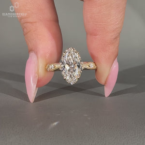 Handmade Lab Grown Diamond Marquise Ring with engraved filigree in shank.
