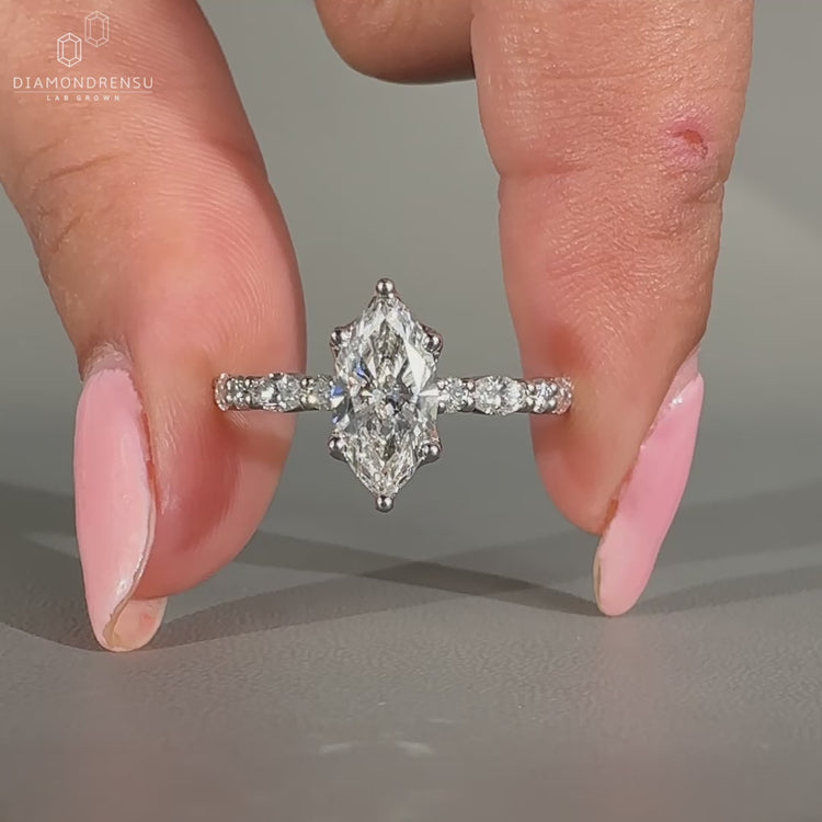 Round cut diamond ring with pave setting.
