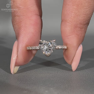 Pave setting ring featuring heart shaped diamond and handmade jewelry.
