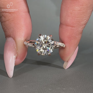 Handmade round diamond ring with six claw prong setting.