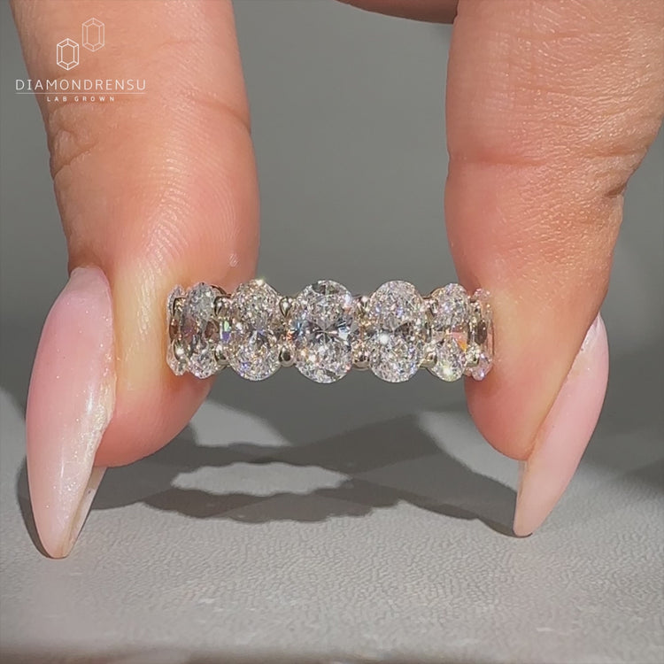 Handmade full eternity wedding band with oval diamonds.