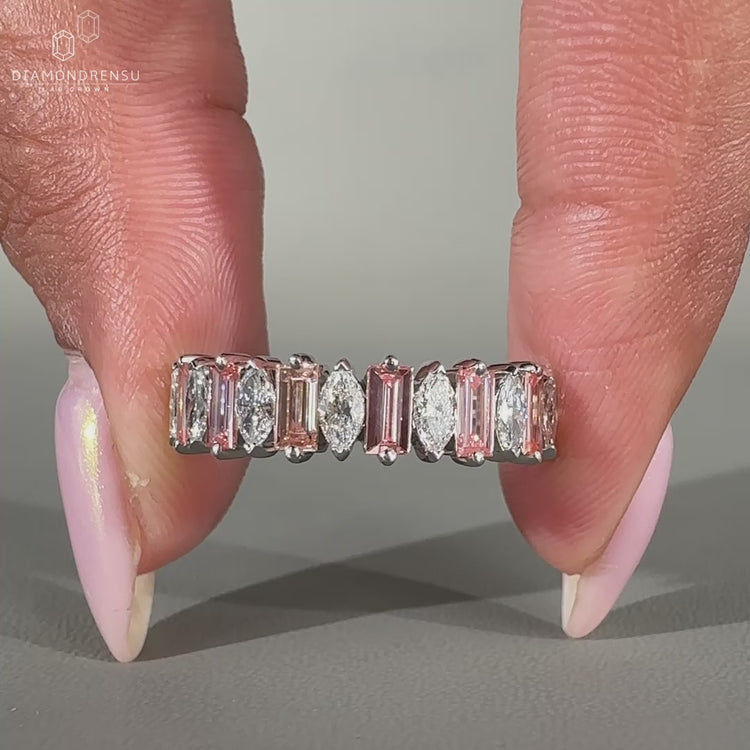 Marquise and Baguette Diamond design in a half eternity wedding band.
