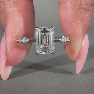 Four claw prong setting securing the diamond.
