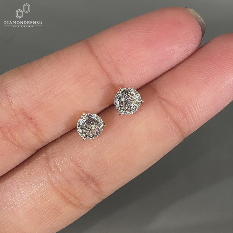 Portuguese diamond earrings with martini setting and three prongs.