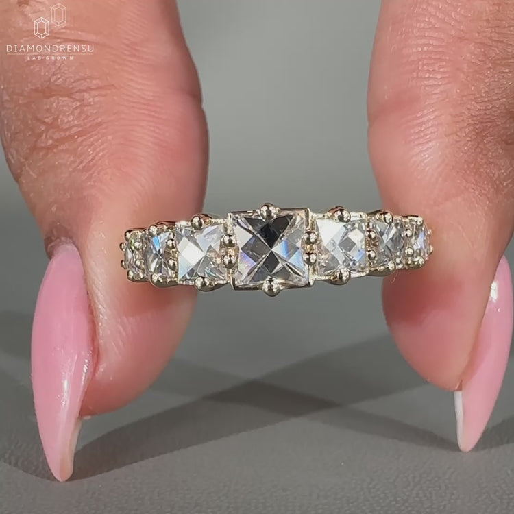 French cut diamond band set in a prong setting for added elegance.
