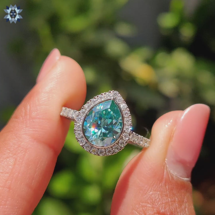 Round Cut Moissanite Ring set in a classic bezel set engagement ring.
