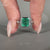 Bezel setting emerald engagement ring.
