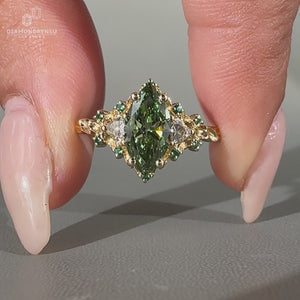 Lab grown marquise diamond ring with vintage style and cluster setting.