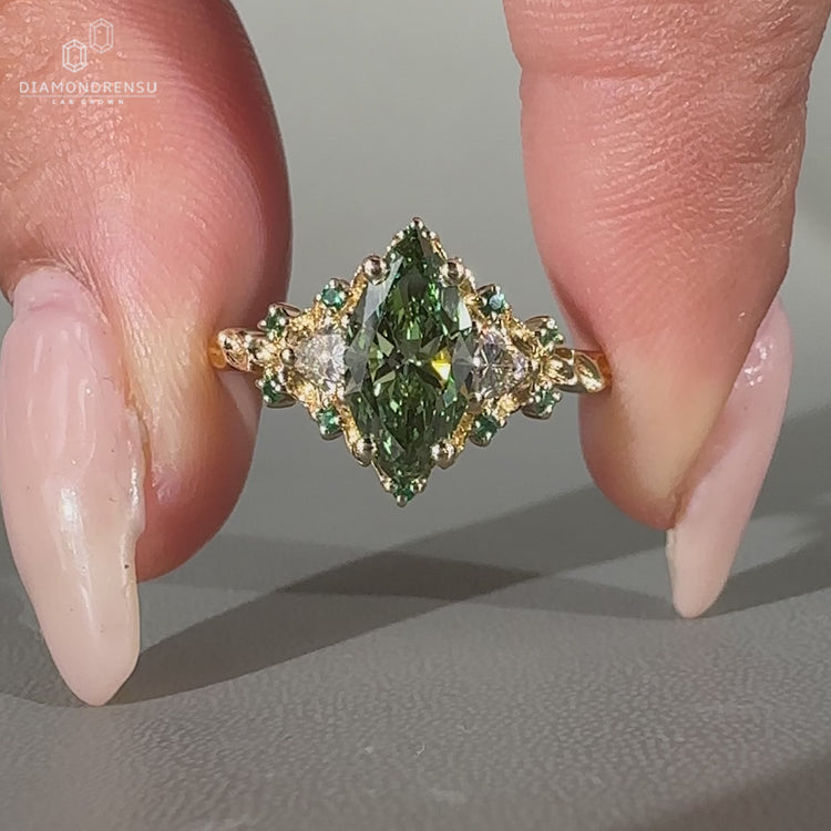 Lab grown marquise diamond ring with vintage style and cluster setting.