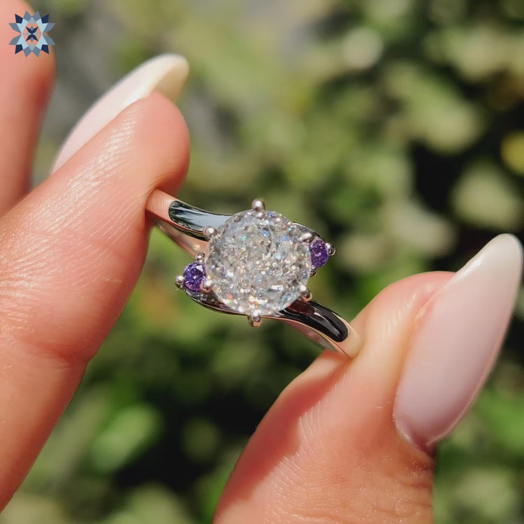 Three-stone moissanite ring with brilliant sparkle.
