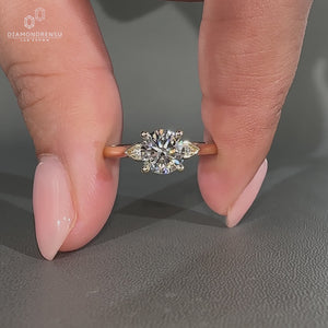 Diamondrensu engagement ring with yellow gold, three stones, and 4 prong setting.