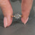Diamondrensu engagement ring with yellow gold, three stones, and 4 prong setting.