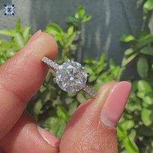 Round cut moissanite engagement ring set for timeless beauty.
