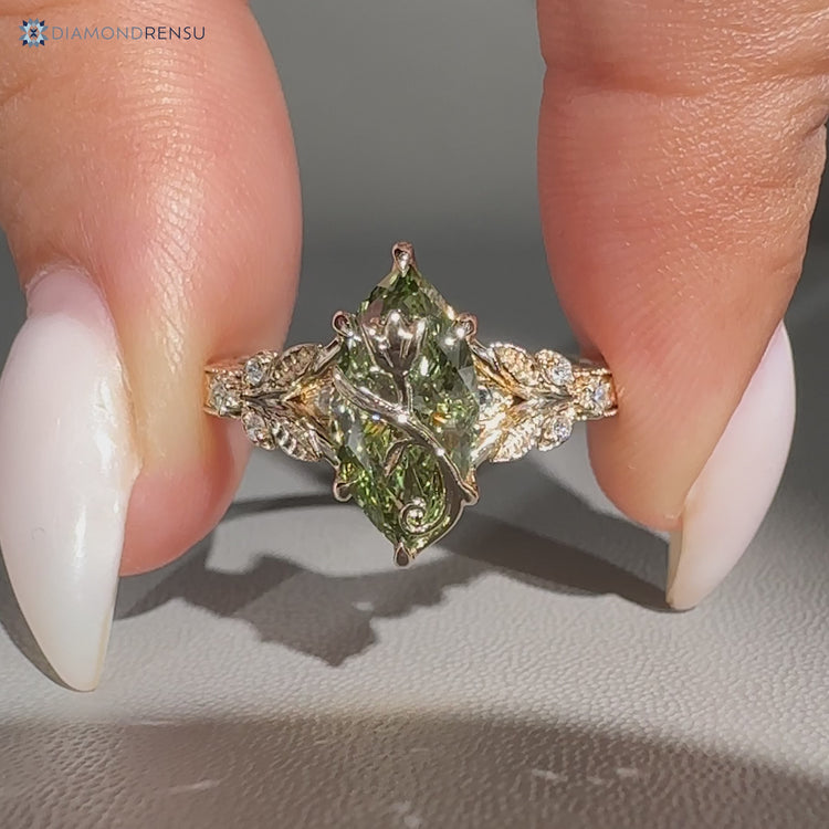 Handmade marquise ring with round side stones by Diamondrensu.