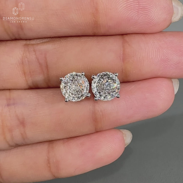 Handmade Portuguese cut diamond earrings with four prong setting.