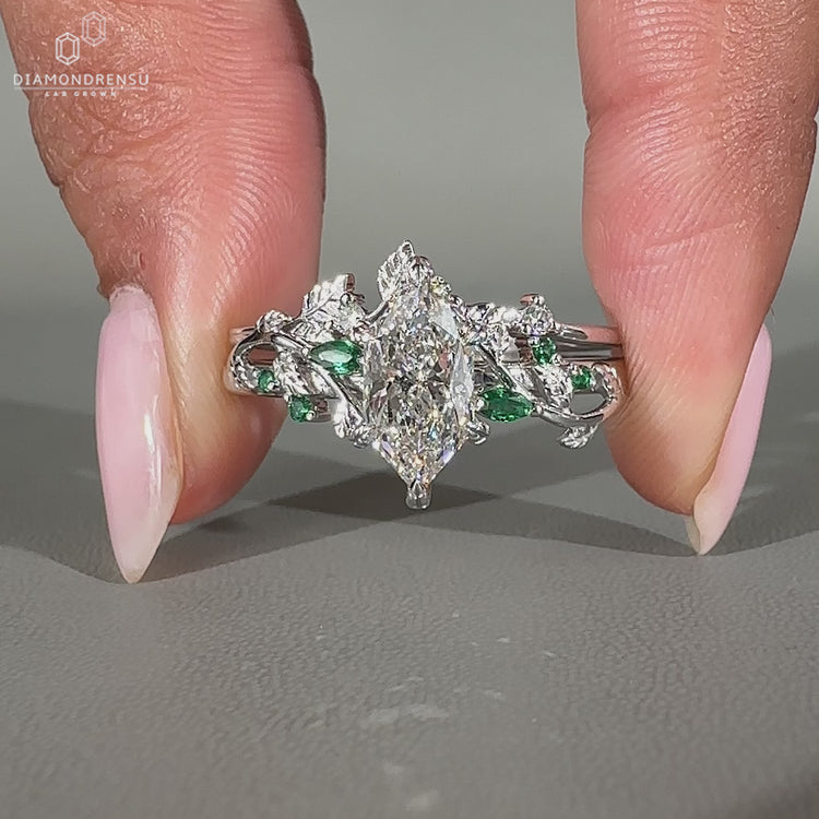 Dutch marquise center stone highlights this diamond band wedding ring.