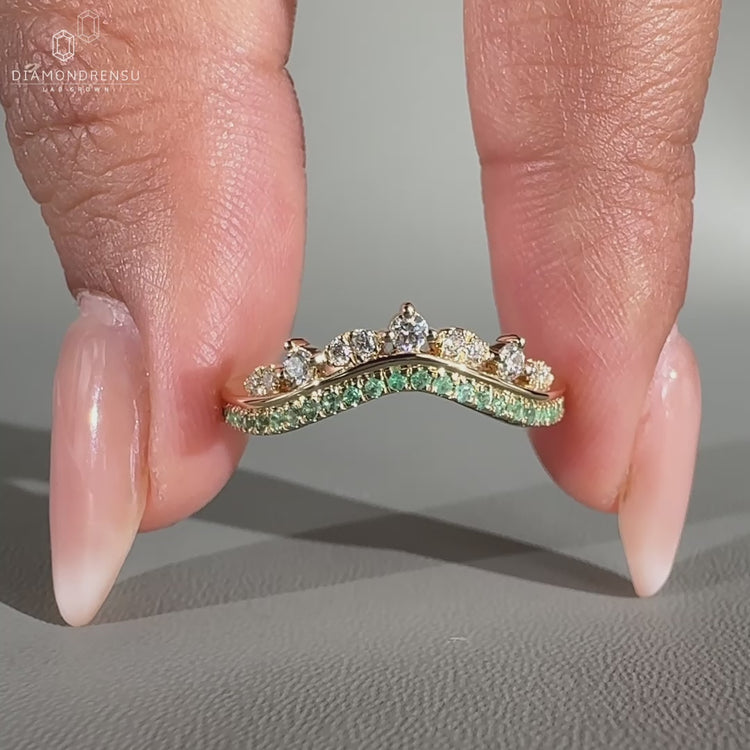 Stylish curvy wedding band with a graceful design, perfect for modern brides.
