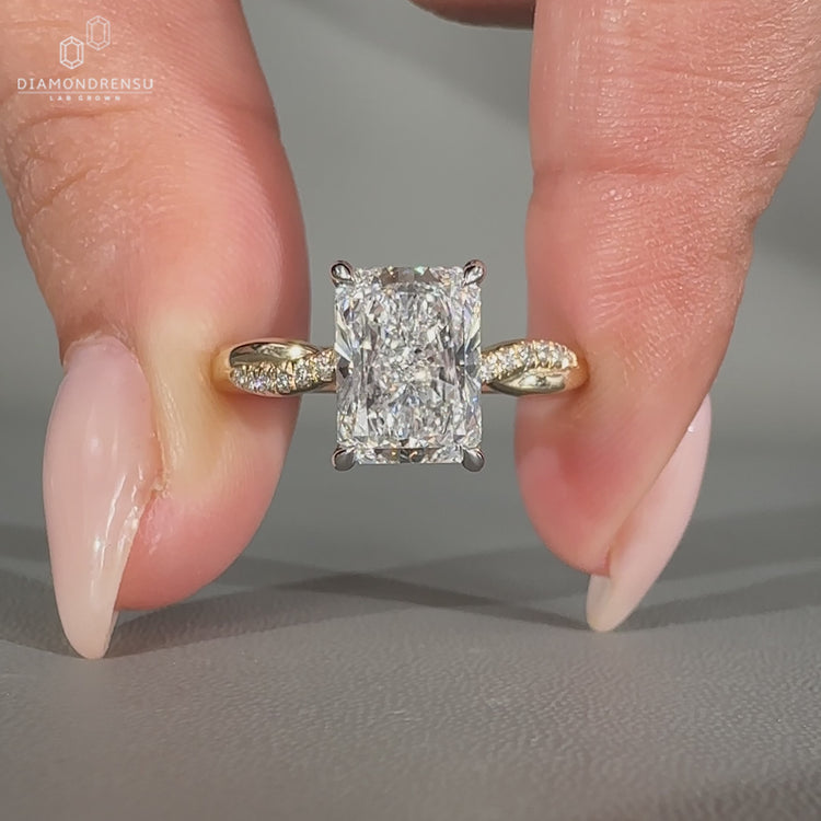 Round cut pave band engagement ring in two tone yellow and white gold.
