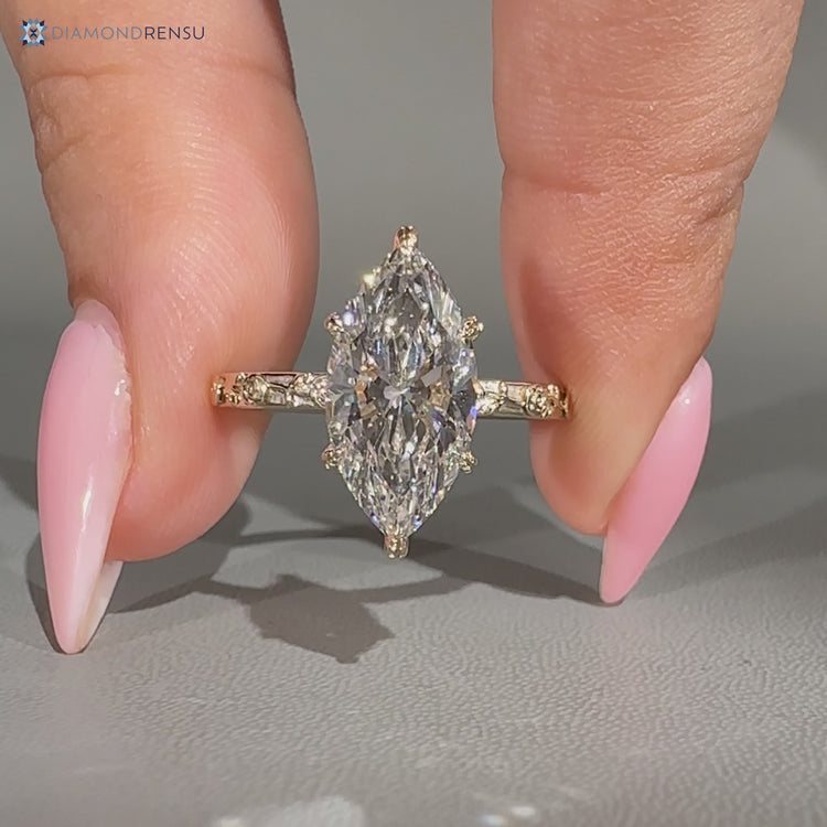 Art Deco engagement ring with a marquise center stone.