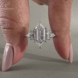 Hexagon cut diamond ring with marquise side stones.