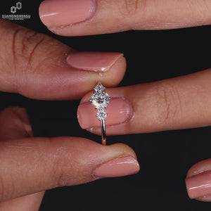 Three stone diamond ring featuring brilliant stones.
