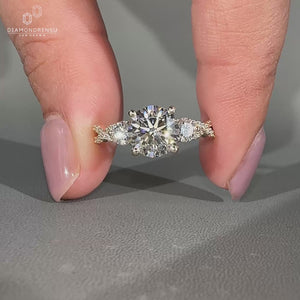 Lab Grown Diamond round cut engagement ring with three stone design.
