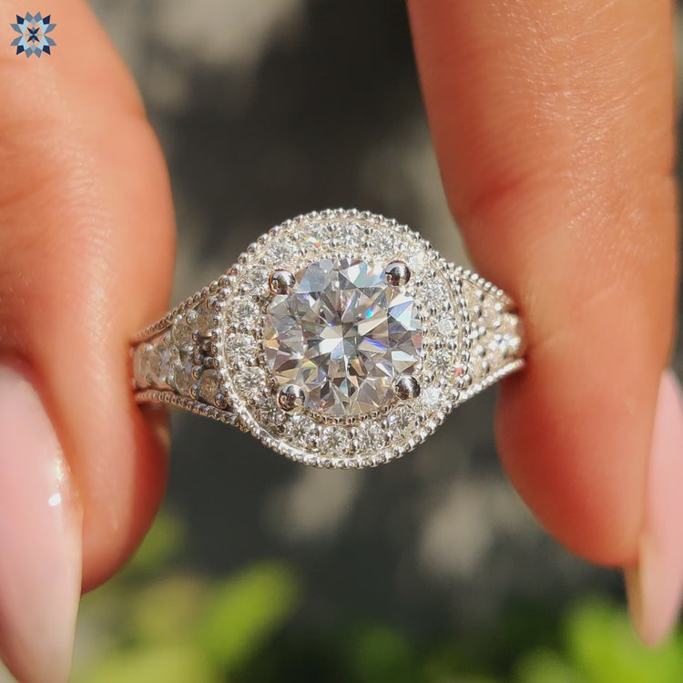 Round moissanite engagement ring with vintage design elements for a timeless appeal.
