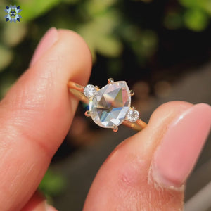 Rose cut pear moissanite center stone.
