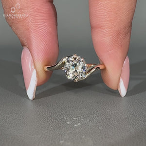 Bypass setting ring with 4 leaf style prong in yellow gold.
