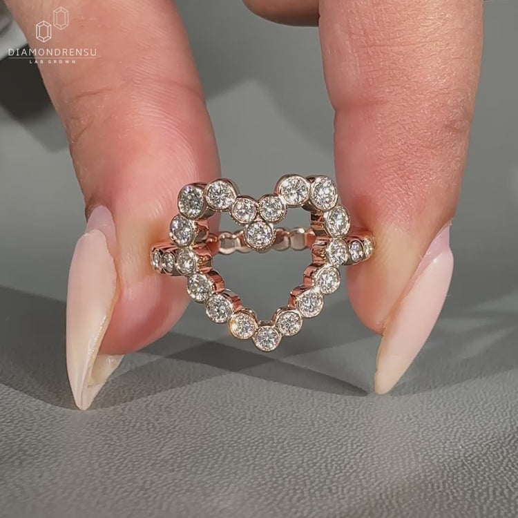 Round diamond ring featuring bezel setting for secure design.
