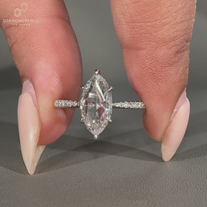 Tapered shank ring featuring pave setting and white gold band.
