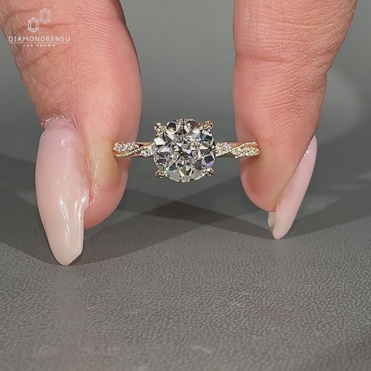 Round old European cut Vintage Diamond Ring with milgrain detail and pave band.