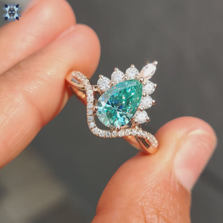 Pear cut cyan blue moissanite cluster pear ring design
