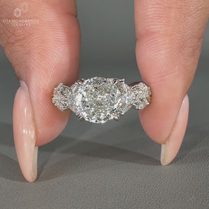 Handmade lab grown diamond ring with a twisted pave band and cathedral setting.