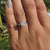 Elegant cushion cut ring displayed in a classic setting, perfect for proposals.
