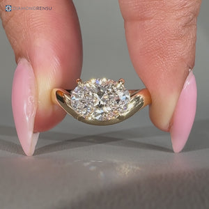 Lab grown oval diamond ring with curved shank design.