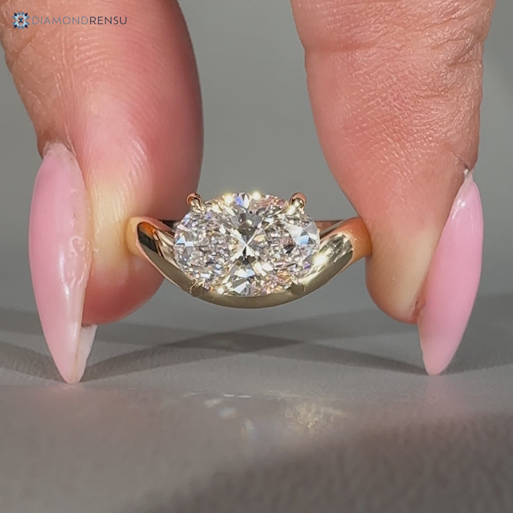 Lab grown oval diamond ring with curved shank design.