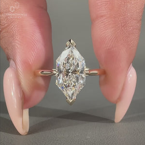 Round Diamond Engagement Ring with a V prong setting and hidden halo design in yellow gold.
