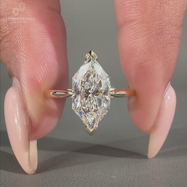 Round Diamond Engagement Ring with a V prong setting and hidden halo design in yellow gold.
