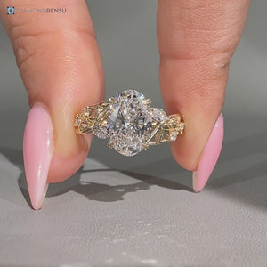 Oval center stone paired with marquise and round side stones.