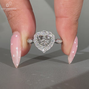 Heart Shape Diamond Ring Surrounded By Round Cut Halo Setting.