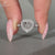Heart Shape Diamond Ring Surrounded By Round Cut Halo Setting.