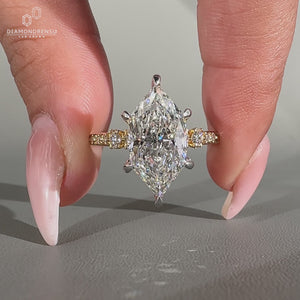 Handmade Dutch marquise ring with cathedral setting and six claw prong.