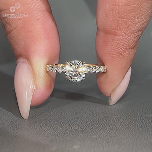 Handmade round cut pave band ring with a 4 prong claw setting.
