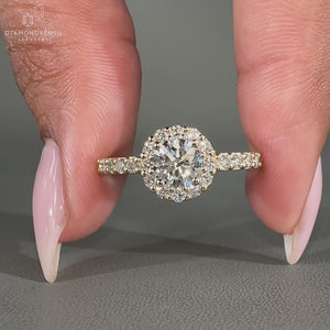 Handmade yellow gold engagement ring with a halo setting.
