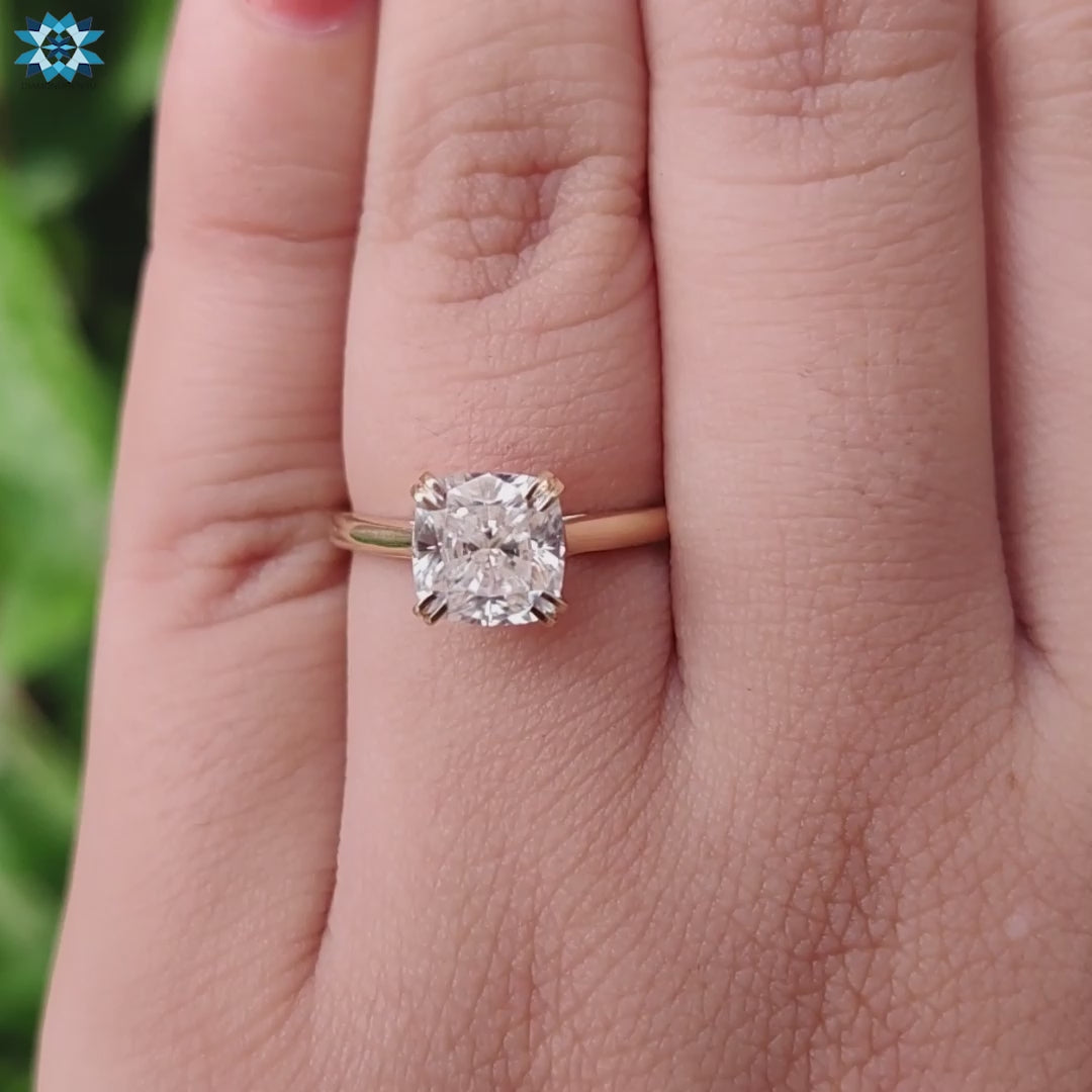 Cushion solitaire engagement ring with a modern, sleek touch.